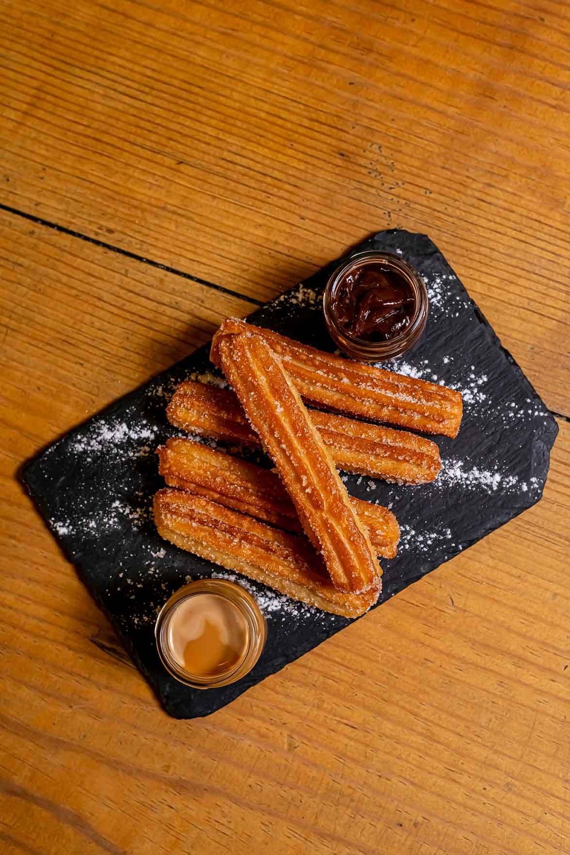 Freshly made churros with dipping sauces