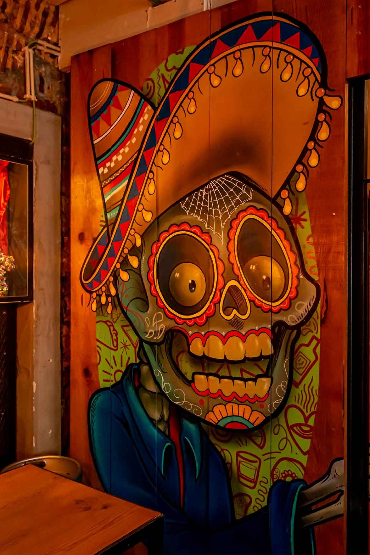 Colorful Day of the Dead mural inside Murals Cantina Mexiacana